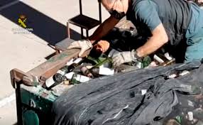 Europe-bound migrants found amid broken glass, toxic ash